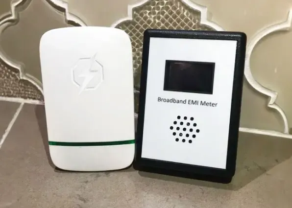 StopWatt device beside an electrical meter